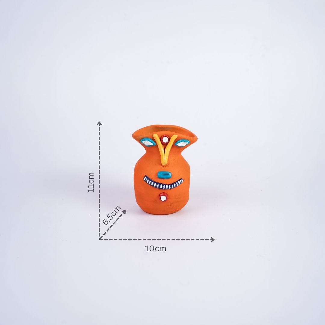 Terracotta Tribal Female Face Pen Stand (Orange) with dm