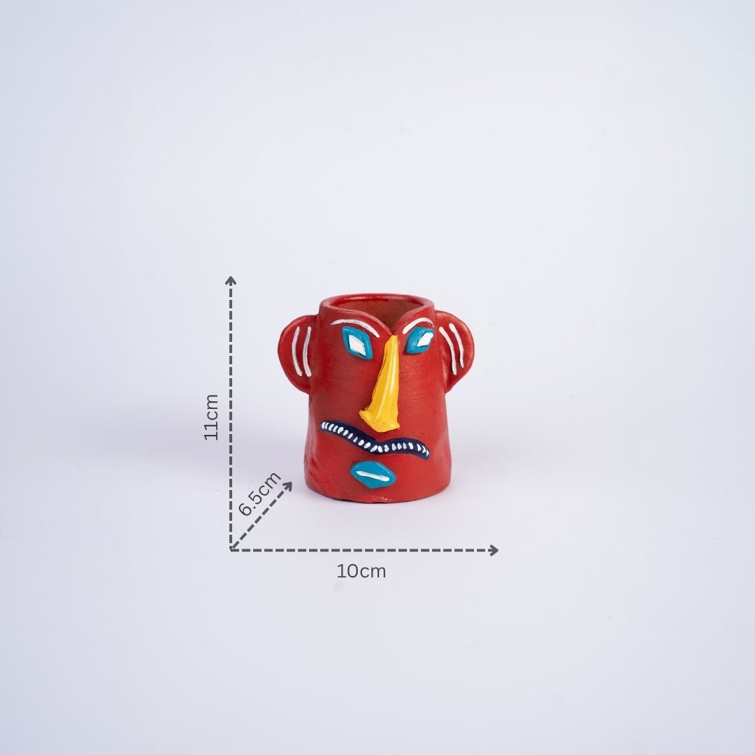 Terracotta Tribal Male Face Pen Stand (Red) with dm