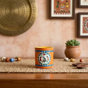 Terracotta Warli Art Hand Painted Cylinder Shaped Pen Stand (Orange)